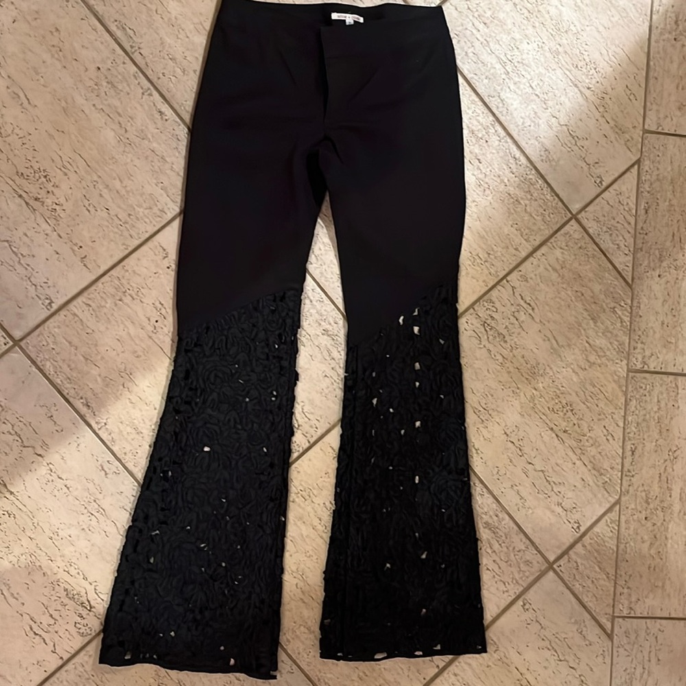Alice & Olivia black cutout flare pants. Beautiful stylish and timeless.